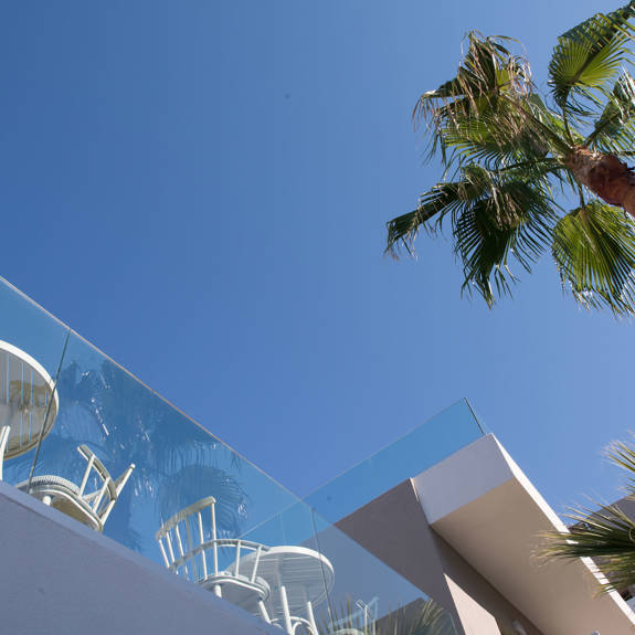 Palm chairs and sky view